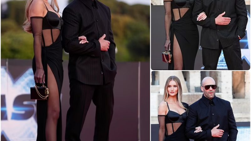 Rosie Huntington-Whiteley Stuns in Semi-Sheer Paneled Gown with Leggy Thigh-High Slit, Supporting Husband Jason Statham